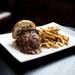 The Poutine Burger  at Grange piled with local grass-fed beef, duck confit poutine gravy, goat cheese curd, made on an avalon brioche bun on Thursday, May 30. Grange is located at 118 West Liberty St. Daniel Brenner I AnnArbor.com